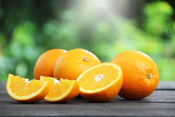 istock Fresh oranges fruit slice on wooden table. 1091874998