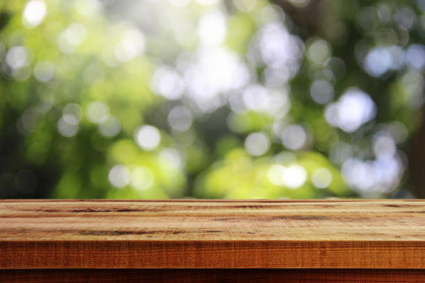 istock Wooden desk and blurred green bokeh background. 1091876876