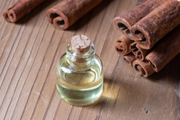 istock A bottle of cinnamon essential oil with cinnamon 1091878176