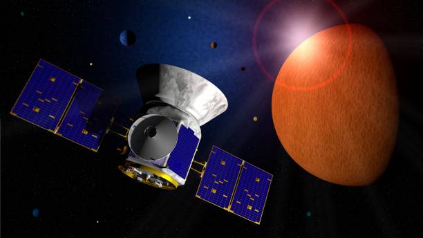 istock Transiting Exoplanet Survey Satellite TESS space telescope traveling through space in search of exo planets 1091879594