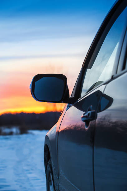 istock car on a snowy road moves 1091879666