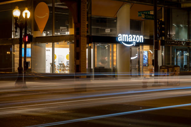 Amazon Pick Up Chicago, USA Oct 8, 2018: Cars passing the Amazon E-commerce pick up store early in the night in the Loop. amazon.com photos stock pictures, royalty-free photos & images