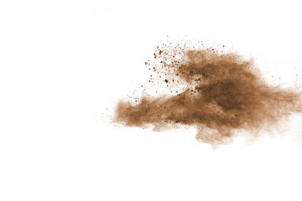 istock Brown color powder explosion on white background. Colored cloud. Colorful dust explode. Paint Holi. 1091880160