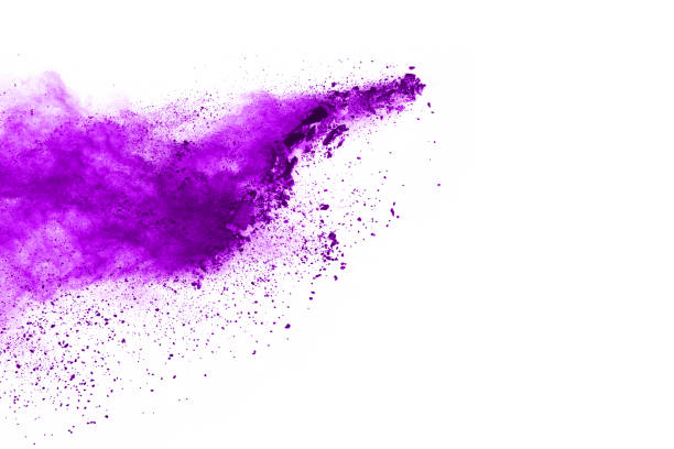 istock Powder explosion. Closeup of a purple dust particle explosion isolated on white. Abstract background. 1091880392