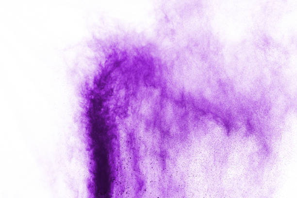 istock Powder explosion. Closeup of a purple dust particle explosion isolated on white. Abstract background. 1091880450
