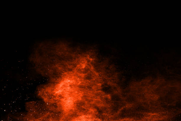 istock Orange powder explosion on black background. Colored cloud. Colorful dust explode. Paint Holi. 1091881356