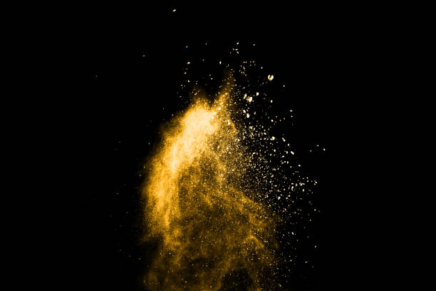 istock Yellow powder explosion on black background. Colored cloud. Colorful dust explode. Paint Holi. 1091883074