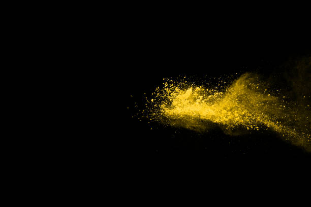 istock Yellow powder explosion on black background. Colored cloud. Colorful dust explode. Paint Holi. 1091883092