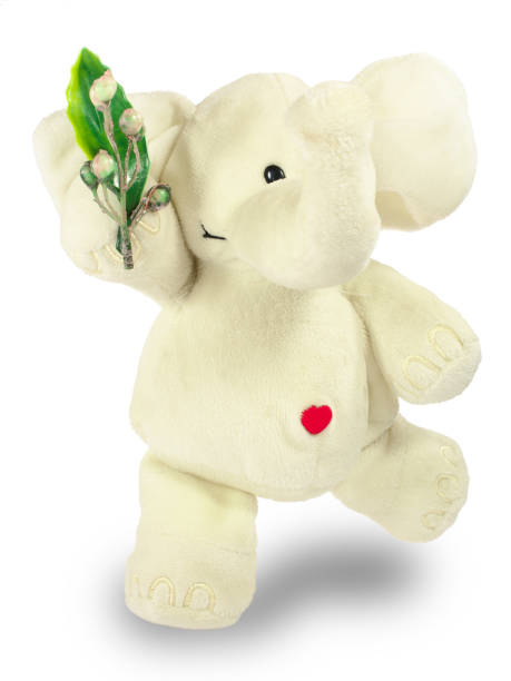 istock Valentine's Day, red heart, white plush elephant, green branch 1091883210
