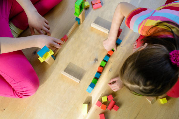 istock children playing with colorful wooden blocks 1091883234