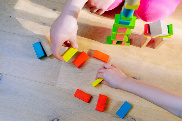 istock children playing with colorful wooden blocks 1091883326