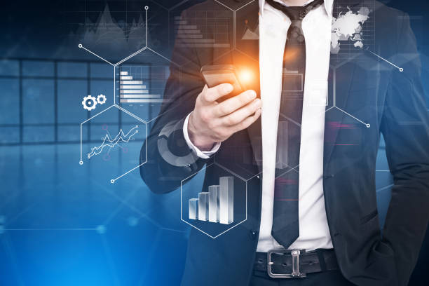 istock Businessman with smartphone infographics interface 1091884984