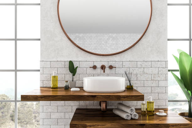 istock Sink close up in brick bathroom interior 1091885508