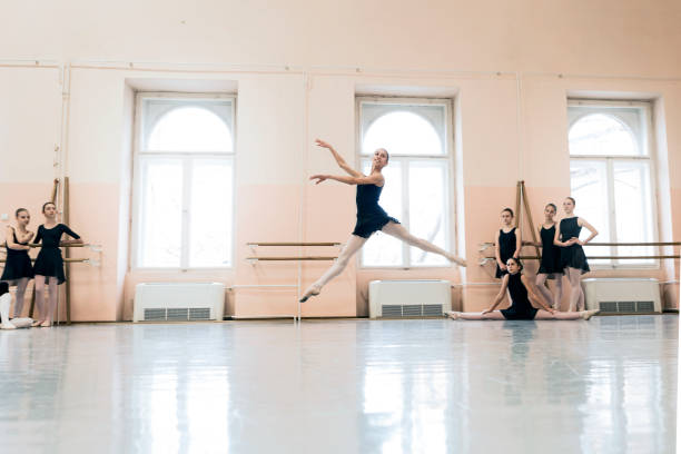 istock Little Ballerina performing in front of class 1091887404