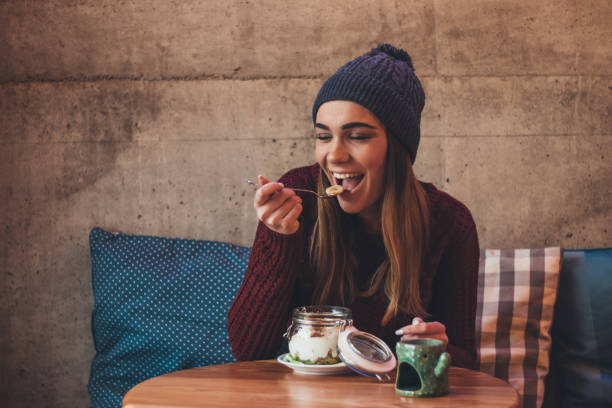 istock Girl enjoys healthy breakfast at cafe 1091888832