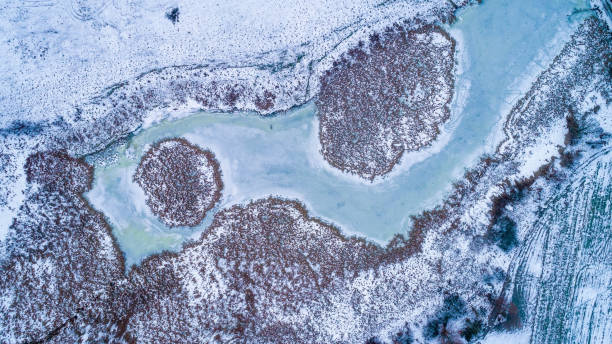 istock Winter landscape with a frozen river.  Aerial drone view 1091892488
