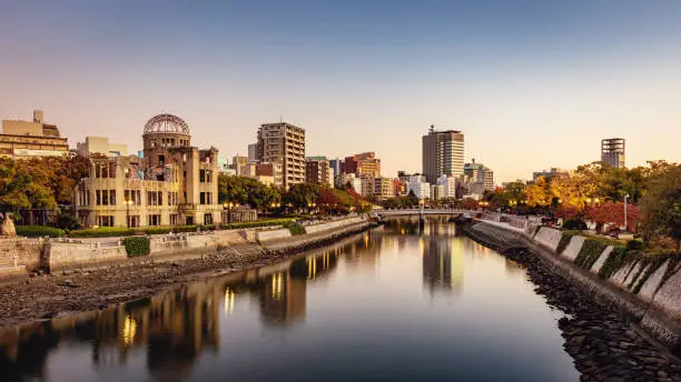Panorama of Hiroshima Cityscape at Twilight. View over the Ota River, Atomic Bomb Dome illuminated on the left side of the river. Hiroshima, Honshu, Japan, Asia.