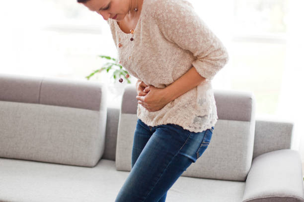 istock Woman Experiencing Abdominal Pain 1091896464