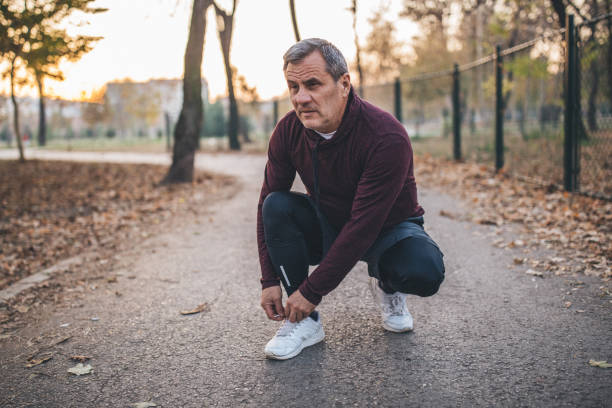 istock Senior runner tying shoelace 1091900838