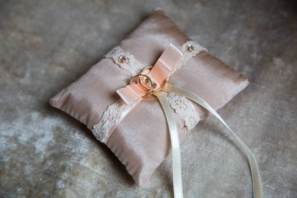 istock A pair of wedding rings on a pink pillow 1091901412