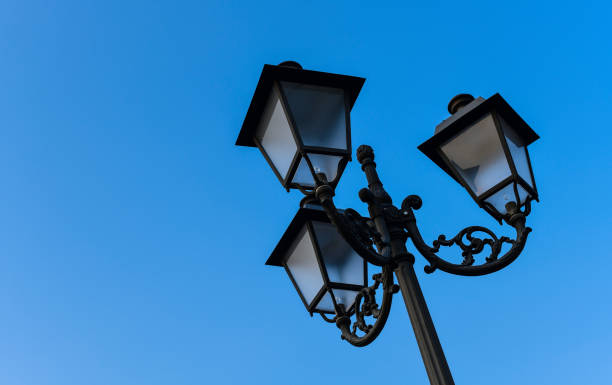 istock Black street lamp against a blue sky 1091903910