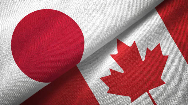 canada and japan two flags together realations textile cloth fabric texture - japanese flag flag japan textile imagens e fotografias de stock