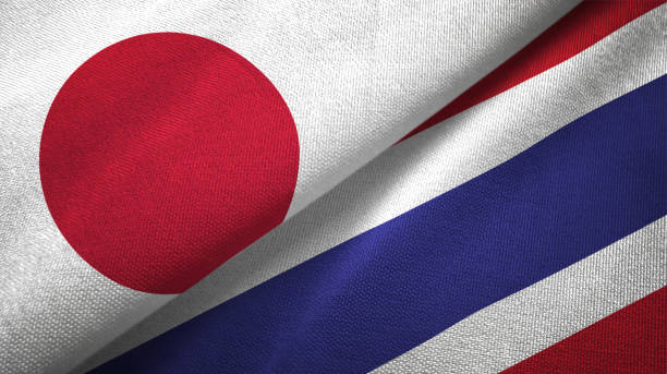 thailand and japan two flags together realations textile cloth fabric texture - japanese flag flag japan textile imagens e fotografias de stock