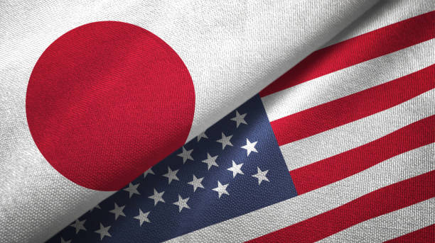 美國和日本兩面旗幟共同實現紡織布織物紋理 - 美洲 個照片及圖片檔