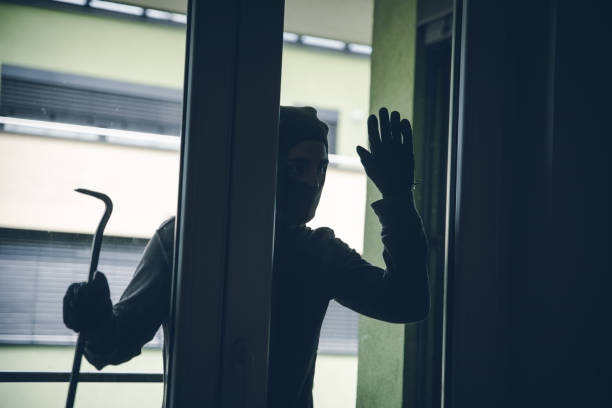 istock Burglar Breaking Into House 1091906342