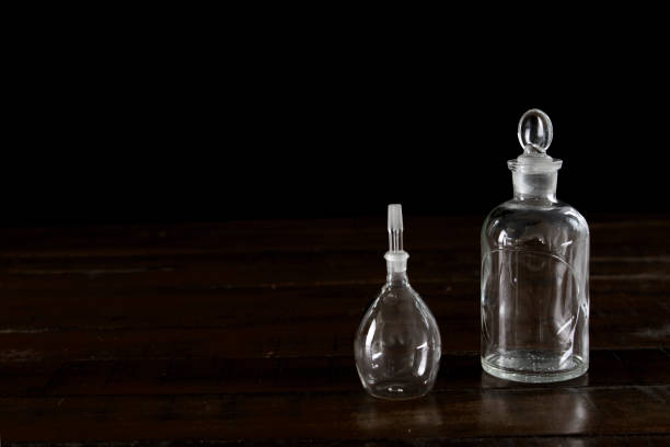 istock Antique glass vials on dark wood background 1091910804