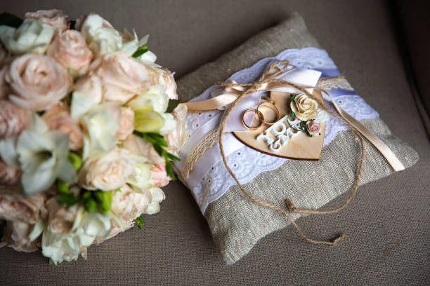 istock A pair of wedding rings on a burlap pillow 1091916612