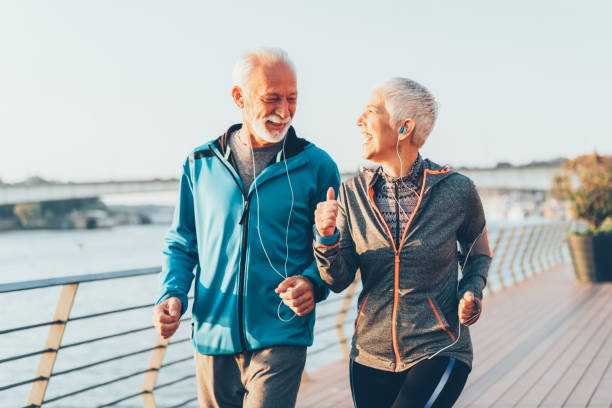 istock Senior couple jogging together 1091921920