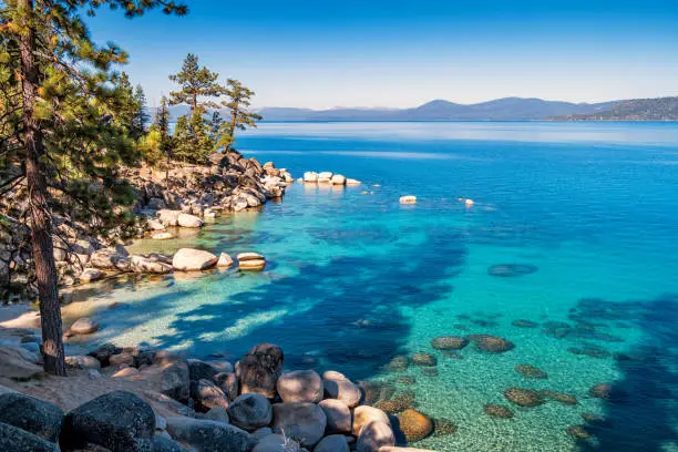 Stock photograph of a beautiful beach at the eastern shores of Lake Tahoe at Sand Harbor, Nevada, USA on a sunny morning.