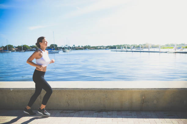 istock Coastal jog, running for exercise along the waterfront 1091935062