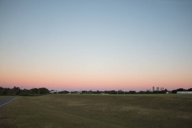 istock sunset over a field pink sky ground 1091935322