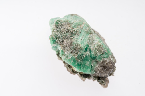 emerald mineral stone sample with white background
