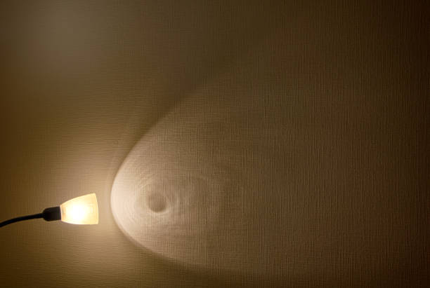 istock The wall lit by a lamp. 1091941132
