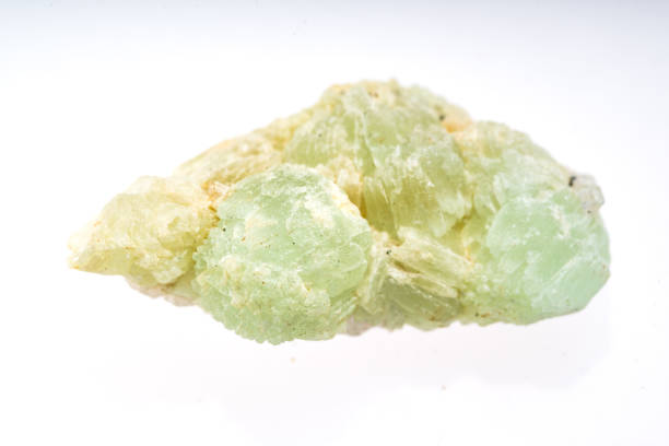 istock Prehnite mineral stone sample with white background 1091941138