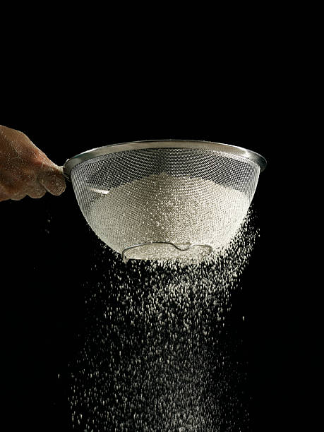 flour  sifting stock pictures, royalty-free photos & images