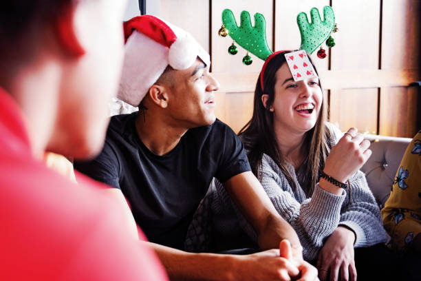 Generation z Christmas party with multi-ethnic friends stock photo