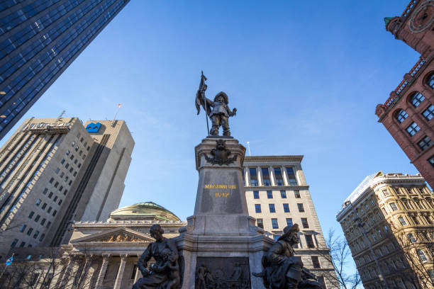 Maisonneuve monument on place d'Armes square during a sunny afternoon in Old Montreal. It is a monument dedicated to De Maisonneuve, the founder of Montreal Picture of Maisonneuve monument during a blue afternoon on the Place d'Armes square in downtown Montreal, Quebec, Canada. Inaugurated in 1895, this monument is in memory of Paul Chomedey de Maisonneuve, founder of Montreal place darmes montreal stock pictures, royalty-free photos & images