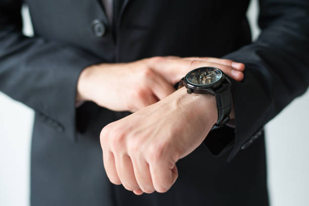 istock Businessman consulting wristwatch 1092004964
