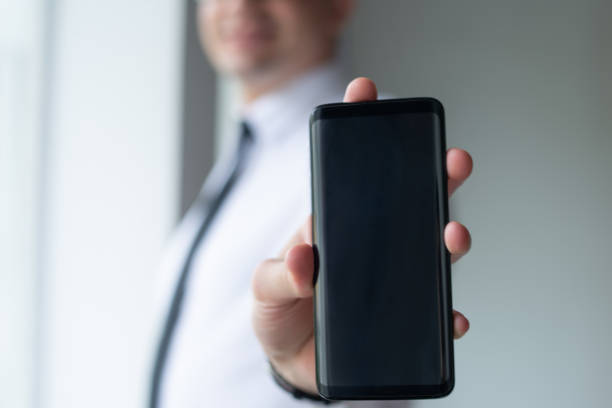 istock Closeup of entrepreneur showing empty smartphone screen 1092005060