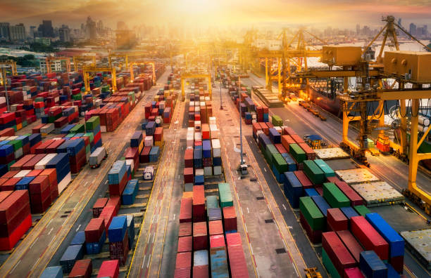 istock Logistics and transportation of Container Cargo ship and Cargo plane with working crane bridge in shipyard at sunrise, logistic import export and transport industry background 1092007572