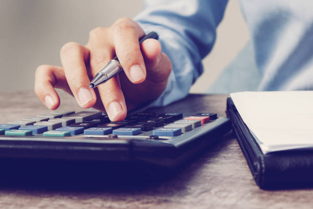 istock Closeup of accountant using calculator 1092014112