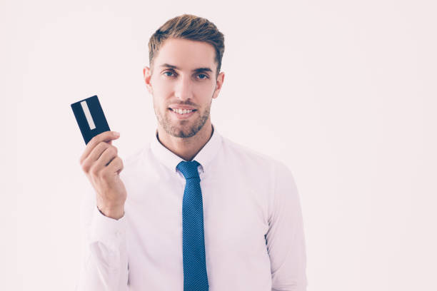 istock Smiling business man holding plastic card 1092016814
