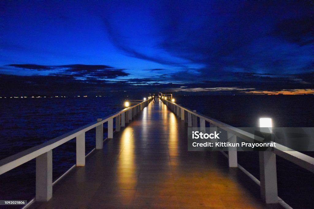 The Bridge and Blue Sky Night time at the Sea Active Lifestyle Stock Photo