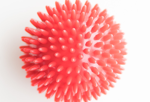 Red spiky massage ball close up