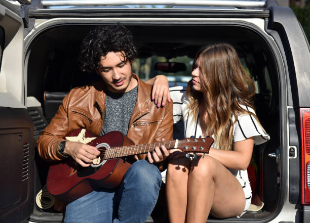 istock Young couple playing guitar 1092026326