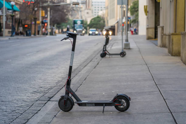 istock Electric Scooter on Sidewalk in Downtown District 1092027678